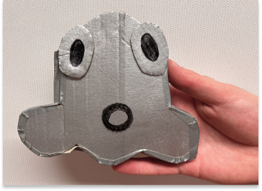 Cardboard controller with two large eyes